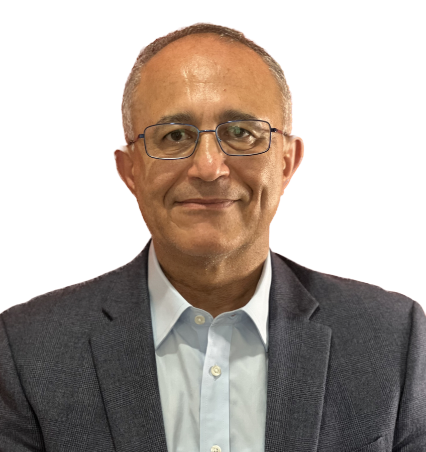 Dr. Al Zeitoun, smiling in a grey blazer